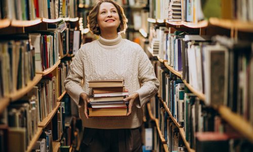 Young woman studying at the library
